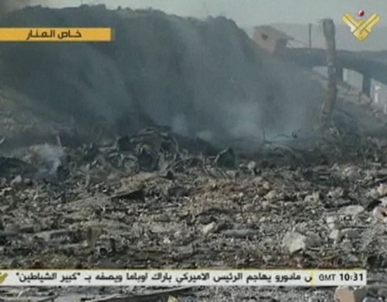 Footage from Lebanon's Al Manar TV, affiliated with Hezbollah, shows smoke rising from what is purportedly an ammunition depot following an air strike in Dimas