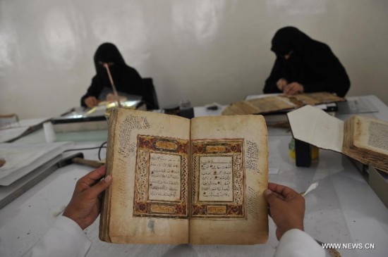 Yemeni experts restore manuscripts inside a repair center in Sanaa, Yemen, on June 2, 2014. Yemeni government began the restoration of the manuscripts in 1980. In the repair center, there are 16,000 ancient parchment fragments, some of which are among the oldest Quran manuscripts in the world.