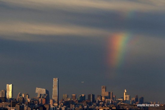 Rainbow appears after hours of rainfalls in Beijing, capital of China, June 6, 2014.