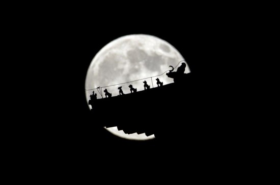 A full moon is seen in the sky over Beijing, capital of China, July 12, 2014. The scientific term for the phenomenon is perigee moon, but it is also known as a 'super moon'.