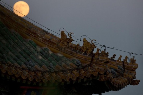 A full moon is seen in the sky over Beijing, capital of China, July 12, 2014. The scientific term for the phenomenon is perigee moon, but it is also known as a 'super moon'.