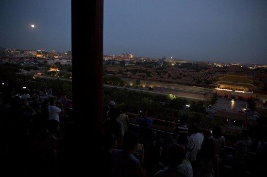 A full moon is seen in the sky over Beijing, capital of China, July 12, 2014. The scientific term for the phenomenon is perigee moon, but it is also known as a 'super moon'.