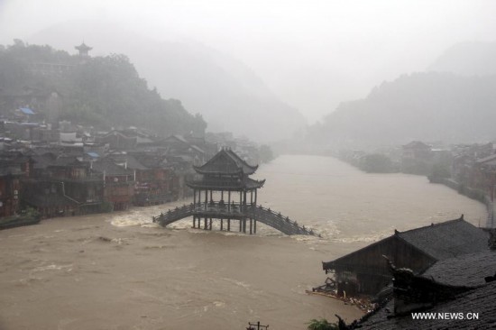 More than 120,000 locals and tourists have been evacuated since Monday night as record downpours hit Fenghuang County, a tourist destination renowned for its ancient town. 