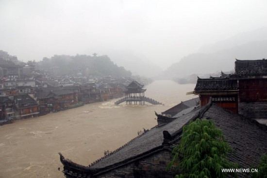 More than 120,000 locals and tourists have been evacuated since Monday night as record downpours hit Fenghuang County, a tourist destination renowned for its ancient town. 