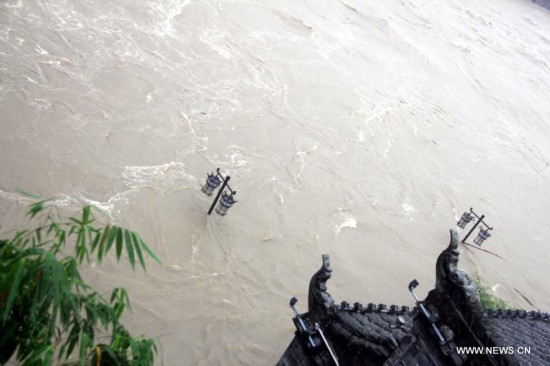 More than 120,000 locals and tourists have been evacuated since Monday night as record downpours hit Fenghuang County, a tourist destination renowned for its ancient town. 