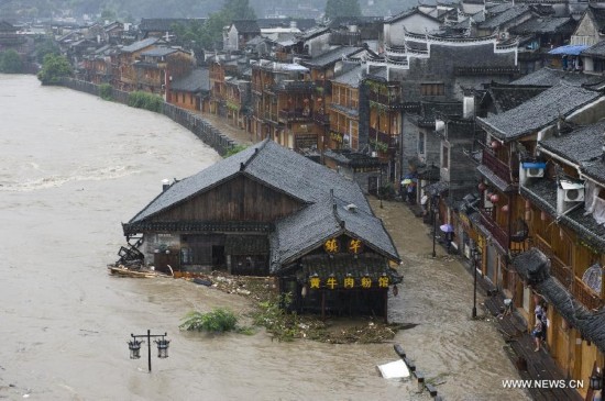 More than 120,000 locals and tourists have been evacuated since Monday night as record downpours hit Fenghuang County, a tourist destination renowned for its ancient town. 