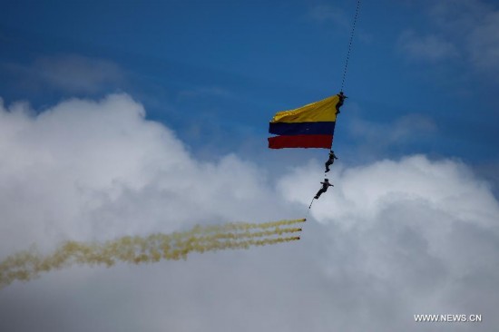 Soldiers of the Air Force perform acrobatics during the annual military parade for the celebration of Independence Day, in Bogota city, capital of Colombia, on July 20, 2014.