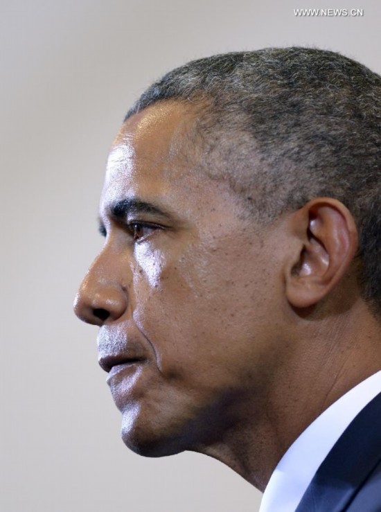 U.S. President Barack Obama pauses when speaking at the Walker Jones Education Campus in Washington D.C., the United States, on July 21, 2014. U.S. President Barack Obama on Monday called for a full, unimpeded and transparent investigation into the crash of Malaysian airliner MH17 in Ukraine.