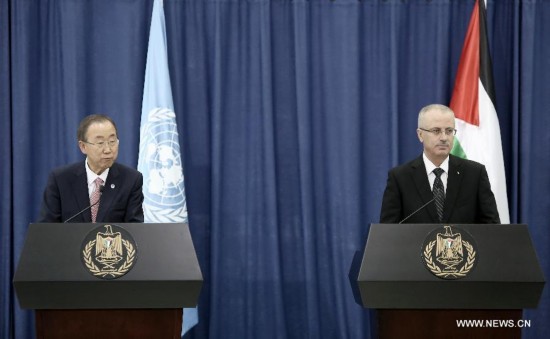 United Nations Secretary General Ban Ki-Moon (L) speaks during a joint news conference with Palestinian Prime Minister Rami Hamdallah in the west bank city of Ramallah on July 22, 2014. 