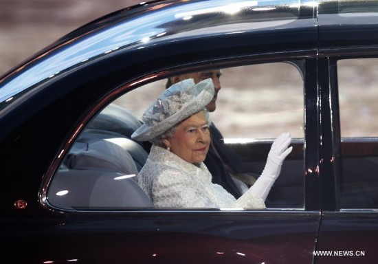 Britain's Queen Elizabeth II and Prince Philip, Duke of Edinburgh, arrive for the opening ceremony of the XX Commonwealth Games at the Celtic Park in Glasgow July 23, 2014.