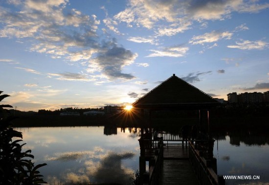 Photo taken on July 24, 2014 shows the evening scenery of Chamu River in Shuangbai County, southwest China's Yunnan Province, July 24, 2014. (Xinhua/Yang Zongyou) 