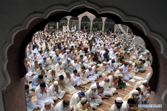 Pakistani Muslims offer Jummat-ul-Vida, the last congregational Friday prayers in the holy month of Ramadan, at a Mosque in northwest Pakistan's Peshawar on July 25, 2014. 