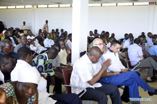 Relatives of victims wait at the international airport of Ouagadougou, Burkina Faso, July 25, 2014. 