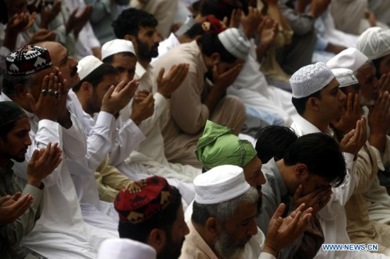Pakistani Muslims offer Jummat-ul-Vida, the last congregational Friday prayers in the holy month of Ramadan, at a Mosque in northwest Pakistan's Peshawar on July 25, 2014. 