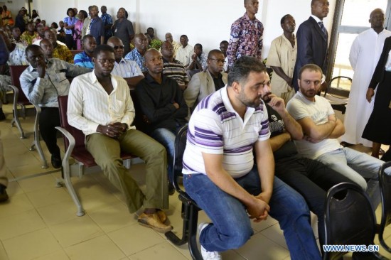 Relatives of victims wait at the international airport of Ouagadougou, Burkina Faso, July 25, 2014. 