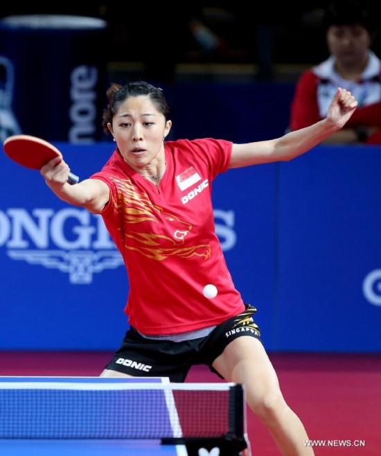 Yu Mengyu of Singapore competes during the women's team final of table tennis against Malaysia's Ng Sock Khim at the 2014 Glasgow Commonwealth Games 