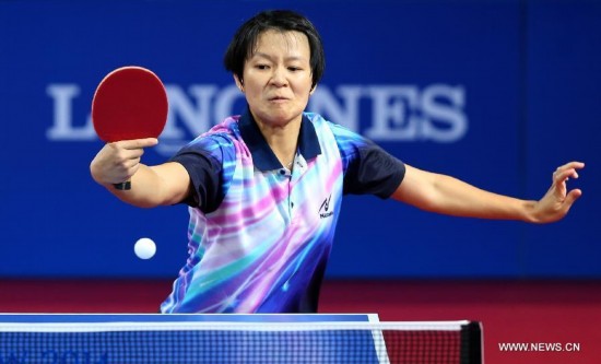 Ng Sock Khim of Malaysia competes during the women's team final of table tennis against Yu Mengyu of Singapore at the 2014 Glasgow Commonwealth Games 