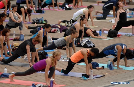 People take part in the 2014 Yogathon in Vancouver, Canada, Aug. 16, 2014.