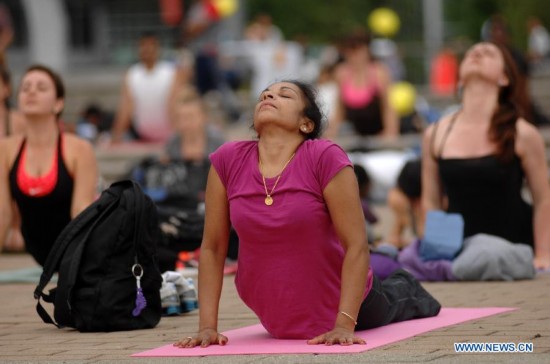 People take part in the 2014 Yogathon in Vancouver, Canada, Aug. 16, 2014.