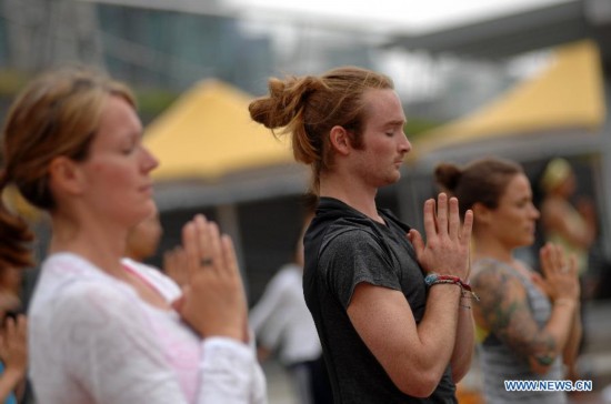 People take part in the 2014 Yogathon in Vancouver, Canada, Aug. 16, 2014. 