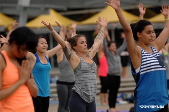 People take part in the 2014 Yogathon in Vancouver, Canada, Aug. 16, 2014.