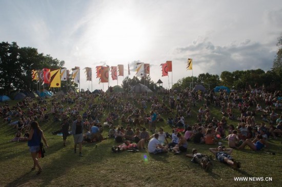 Festival goers rest on the grass during the Sziget (Hungarian for 'Island') Festival on the Obuda Island in Budapest, Hungary on August 16, 2014. The 22nd edition of the Sziget Festival lasts from August 11 to August 17. 