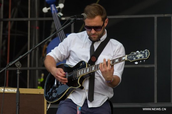 Szabolcs Ivanyi, guitar player of the Hungarian band Punnany Massif plays at a concert during the Sziget (Hungarian for 'Island') Festival on the Obuda Island in Budapest, Hungary on August 16, 2014. 