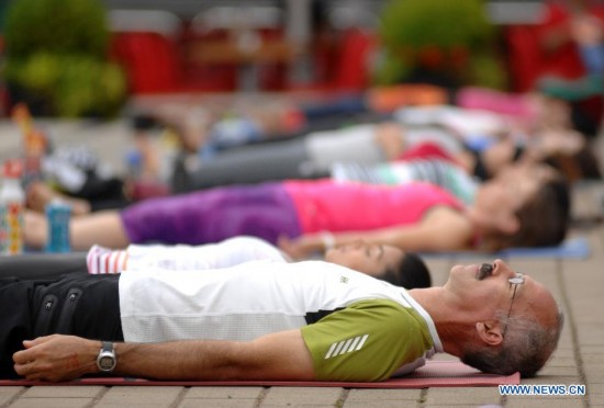 People take part in the 2014 Yogathon in Vancouver, Canada, Aug. 16, 2014.