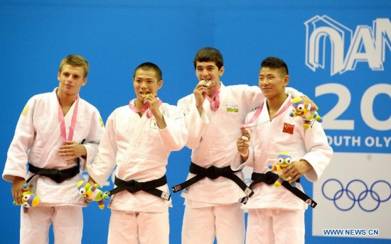 Bogdan Iadov of Ukraine(1st, L), Abe Hifumi of Japan(2nd, L), Sukhrob Tursunov of Uzbekistan(3rd, L) and Wu Zhiqiang of China pose after Men -66 kg of Judo event of Nanjing 2014 Youth Olympic Games 