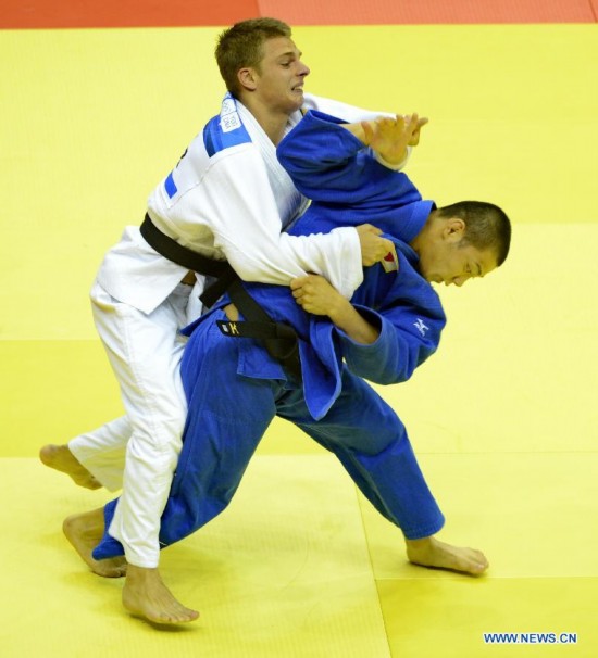 Abe Hifumi of Japan(L) competes with Bogdan Iadov of Ukraine during Men -66 kg of Judo event of Nanjing 2014 Youth Olympic Games 