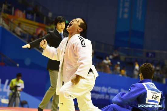 Bauyrzhan Zhauyntayev of Kazakhstan celebrates after Men -55 kg of Judo event of Nanjing 2014 Youth Olympic Games