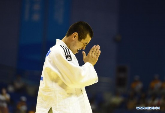 Bauyrzhan Zhauyntayev of Kazakhstan celebrates after Men -55 kg of Judo event of Nanjing 2014 Youth Olympic Games