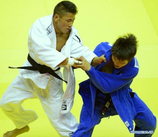 Wu Zhiqiang of China(L) competes with Ryu Seunghwan of Republic of Korea during Men -66 kg of Judo event of Nanjing 2014 Youth Olympic Games