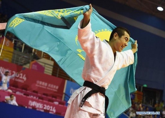 Bauyrzhan Zhauyntayev of Kazakhstan celebrates after Men -55 kg of Judo event of Nanjing 2014 Youth Olympic Games