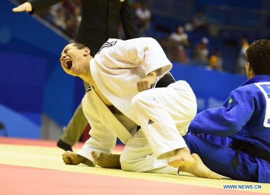 Bauyrzhan Zhauyntayev of Kazakhstan celebrates after Men -55 kg of Judo event of Nanjing 2014 Youth Olympic Games