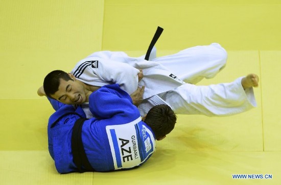 Bauyrzhan Zhauyntayev(Top) of Kazakhstan competes with Natig Gurbanli of Azerbaijan during Men -55 kg of Judo event of Nanjing 2014 Youth Olympic Games