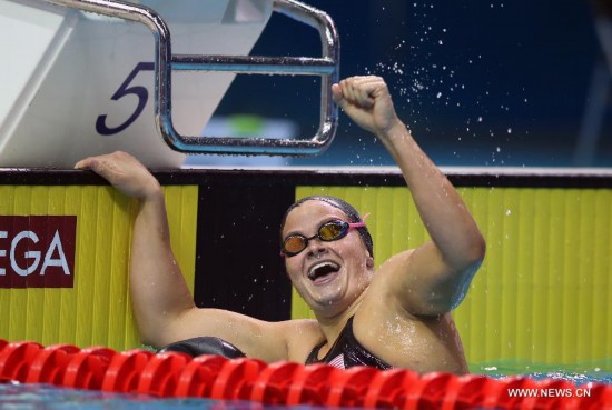 Clara Smiddy(C)of United States of American celebrates during the Women's 100m Backstroke match at Nanjing 2014 Youth Olympic Games