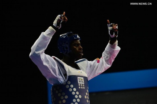 Yoann Miangue of France celebrates after the men+73kg final of Taekwondo event during Nanjing 2014 Youth Olympic Games in Nanjing, capital of east China’s Jiangsu Province, on Aug. 21, 2014.