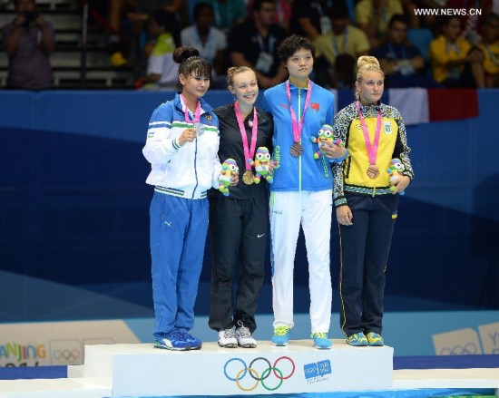 Gold medalist Kendall Yount(2nd, L) of the United States, silver medalist Umida Abdullaeva(1st, L) of Uzbekistan, bronze medalist Li Chen(2nd, R) of China and Yuliia Miiuts of Ukraine pose during the awarding ceremony of the Women +63kg final of Taekwondo at the Nanjing 2014 Youth Olympic Games in Nanjing, capital of east China's Jiangsu Province, on August 21, 2014.