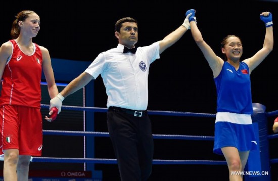 Chang Yuan of China celebrates after winning the Women's Fly (48-51kg) Boxing final match at Nanjing 2014 Youth Olympic Games in Nanjing, capital of east China's Jiangsu Province, on Aug. 26, 2014.Chang Yuan of China won the gold medal.