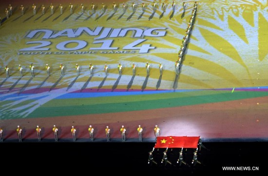 The national flag of People’s Republic of China enters the stadium during the closing ceremony of Nanjing 2014 Youth Olympic Games in Nanjing, capital of east China’s Jiangsu Province, Aug. 28, 2014. 