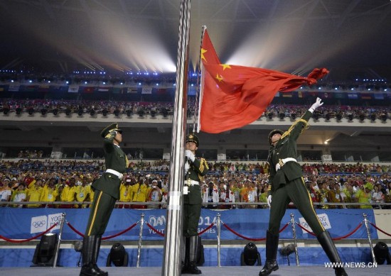 The national flag of People’s Republic of China is raised during the closing ceremony of Nanjing 2014 Youth Olympic Games in Nanjing, capital of east China’s Jiangsu Province, Aug. 28, 2014.