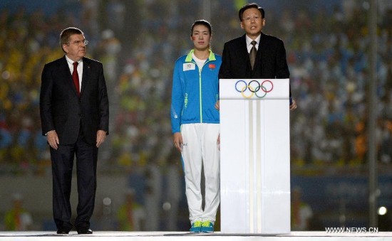 The President of Nanjing Youth Olympic Games Organizing Committee (NYOGOC) Li Xueyong(R) speaks during the closing ceremony of Nanjing 2014 Youth Olympic Games in Nanjing, capital of east China’s Jiangsu Province, Aug. 28, 2014.