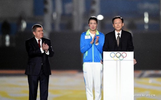 The President of Nanjing Youth Olympic Games Organizing Committee (NYOGOC) Li Xueyong(R) speaks during the closing ceremony of Nanjing 2014 Youth Olympic Games in Nanjing, capital of east China’s Jiangsu Province, Aug. 28, 2014. 