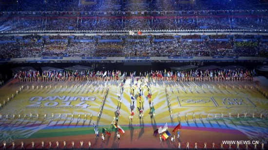 Flags of national delegations enter the stadium during the closing ceremony of Nanjing 2014 Youth Olympic Games in Nanjing, capital of east China’s Jiangsu Province, Aug. 28, 2014. 