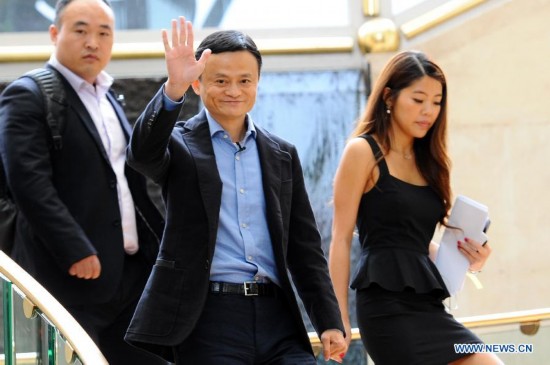Founder and chairman of Alibaba Group Ma Yun (C) gestures during a roadshow in Singapore, Sept. 16, 2014.