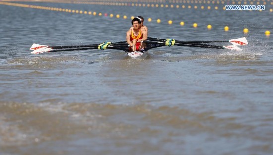 Athletes of China compete during the lightweight men's quadruple sculls final of rowing at the 17th Asian Games in Chungju, South Korea, Sept. 25, 2014. China won the gold medal.