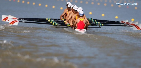 Athletes of China compete during the men's eight final of rowing at the 17th Asian Games in Chungju, South Korea, Sept. 25, 2014. China won the gold medal.