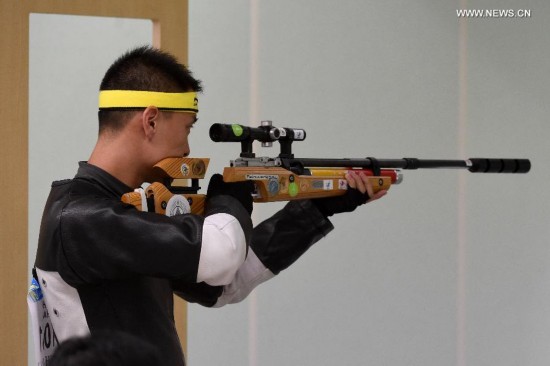 Zhai Yujia of China celebrates after the 10m running target men's gold medal competition of shooting at the 17th Asian Games in Incheon, South Korea, Sept. 25, 2014. Zhai Yujia won the gold medal.