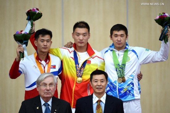 Zhai Yujia of China celebrates after the 10m running target men's gold medal competition of shooting at the 17th Asian Games in Incheon, South Korea, Sept. 25, 2014. Zhai Yujia won the gold medal.